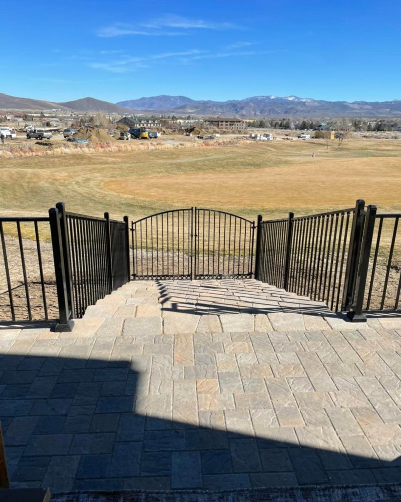 Custom gates leading to a private backyard entrance