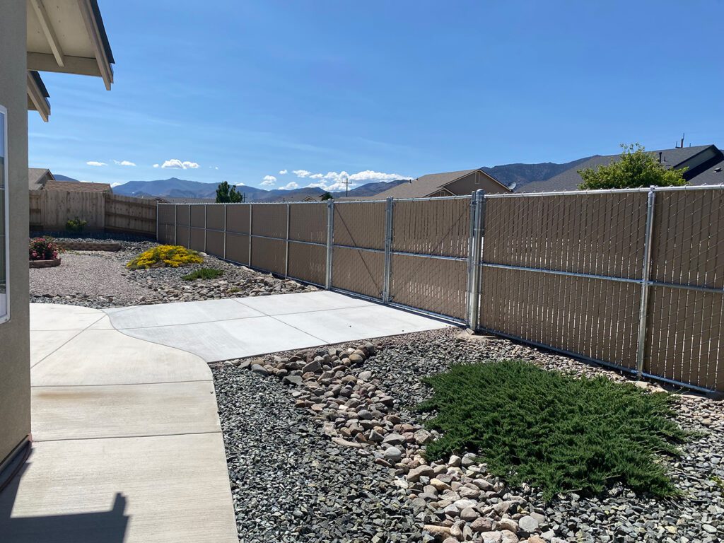 hw to secure a chain link fence at the bottom 